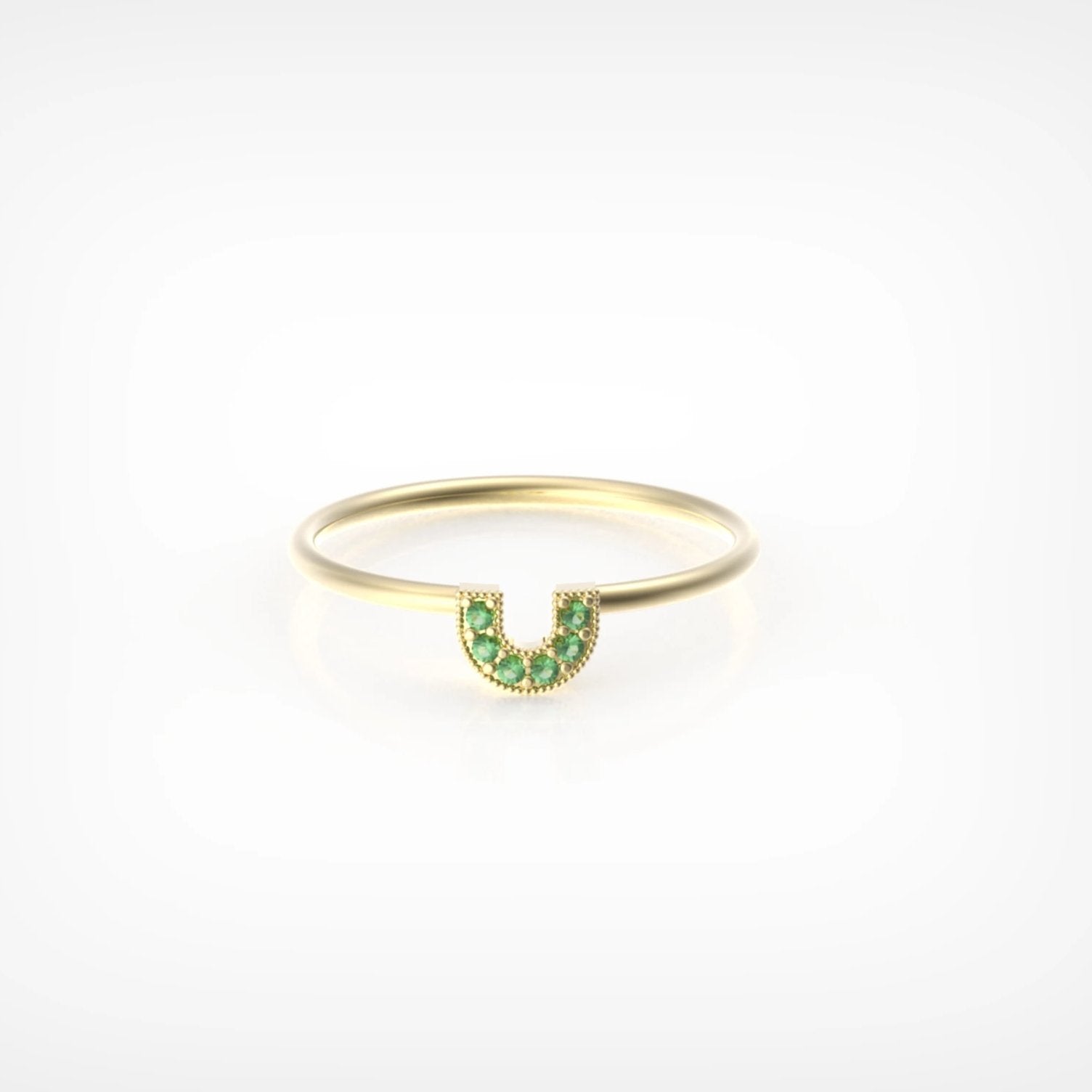 טבעת פרסה עם אבני אמרלד