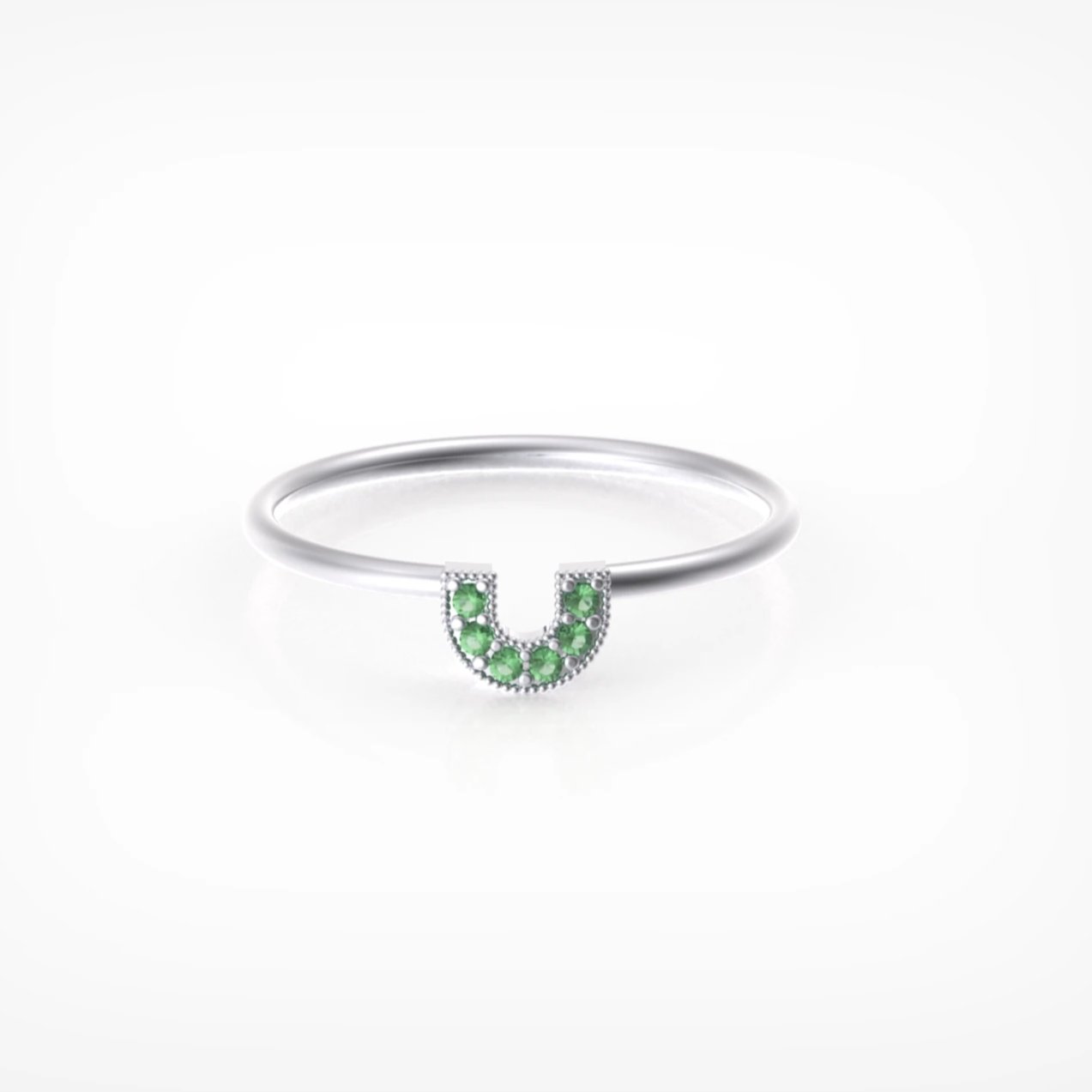 טבעת פרסה עם אבני אמרלד