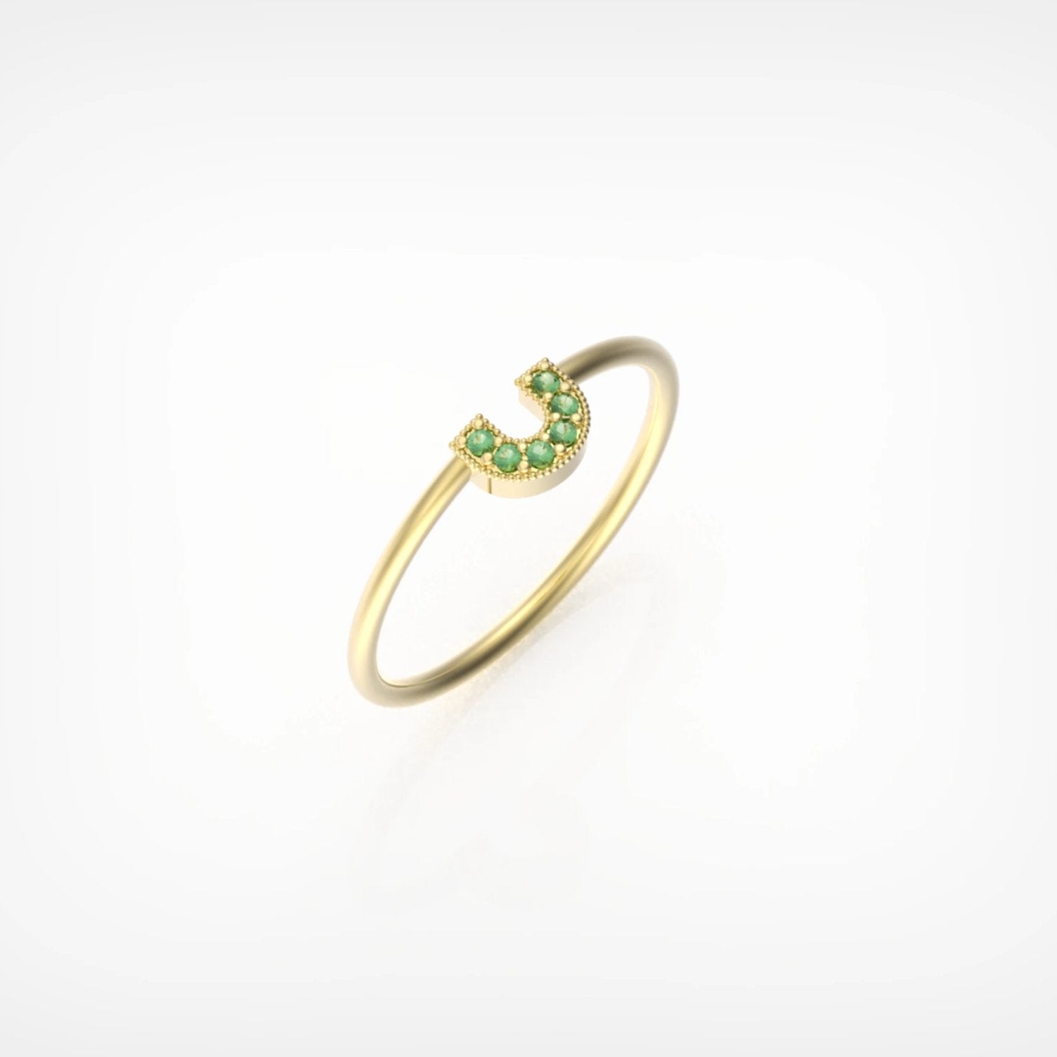 טבעת פרסה עם אבני אמרלד