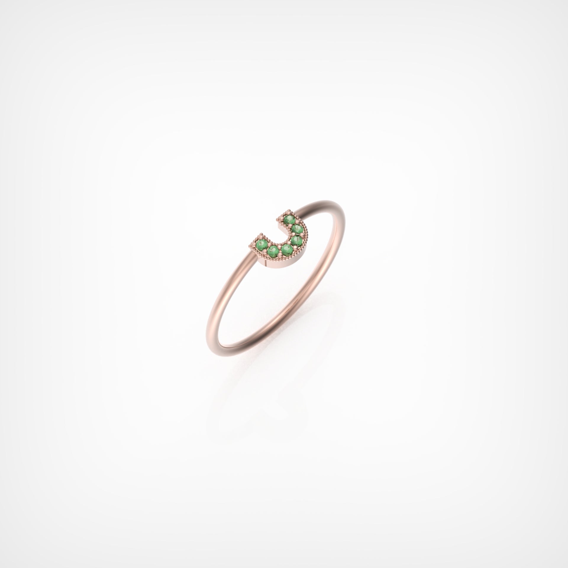 טבעת פרסה עם אבני אמרלד